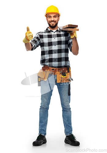 Image of worker or builder with boards showing thumbs up