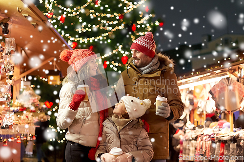 Image of family with takeaway drinks at christmas market