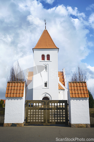 Image of Gate to a beuatiful white church