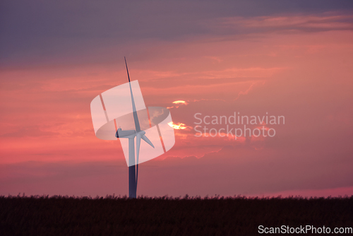 Image of Windmill in a beautiful violet sunset