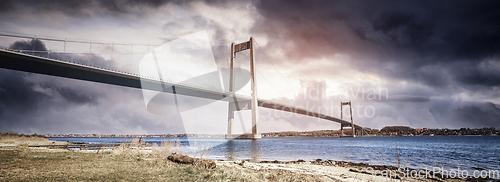 Image of Bridge over water in a dramatic panorama scenery