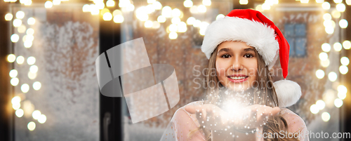 Image of teenage girl with magical fairy dust on christmas