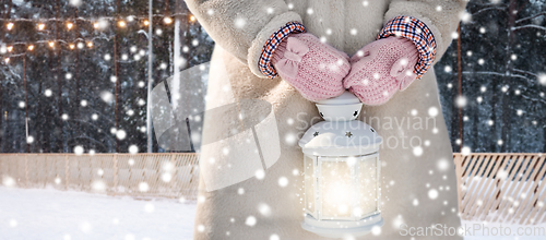 Image of close up of girl with magical christmas lantern