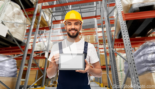 Image of male worker with tablet computer at warehouse