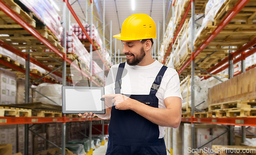 Image of male worker with tablet computer at warehouse