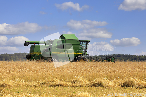 Image of John Deere Combine Harvester in Field