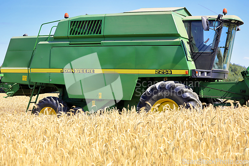 Image of John Deere Combine Harvester in Field, Detail