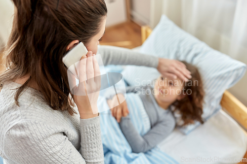 Image of ill daughter and mother calling on phone at home