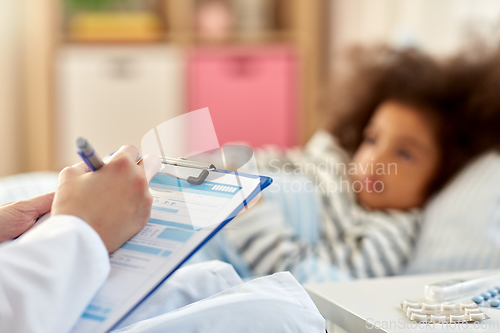 Image of doctor with clipboard and sick girl in bed at home