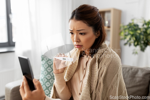 Image of sick woman having video call on smartphone