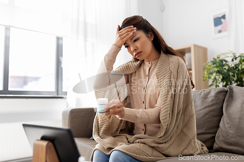 Image of sick woman with medicine has video consultation