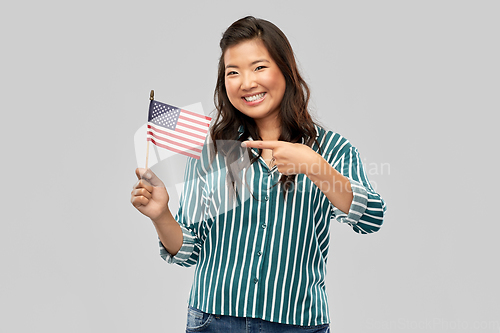 Image of happy asian woman with flag of america