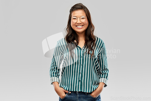 Image of happy asian woman in glasses or student