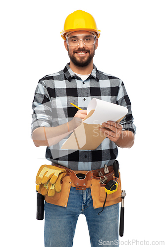 Image of male worker or builder in helmet with clipboard