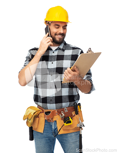 Image of happy builder with clipboard calling on smartphone