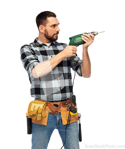 Image of male worker or builder with drill and tools