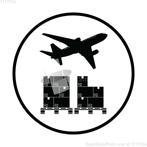 Image of Boxes on pallet under airplane