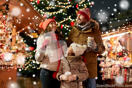 Image of family with takeaway drinks at christmas market