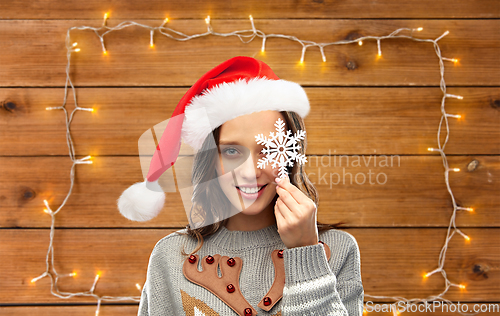 Image of woman in christmas sweater with reindeer pattern