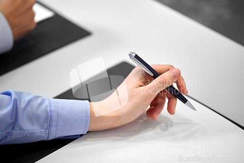 Image of close up of businesswoman with paper at office