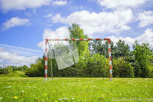 Image of Old handball goal with a broken net