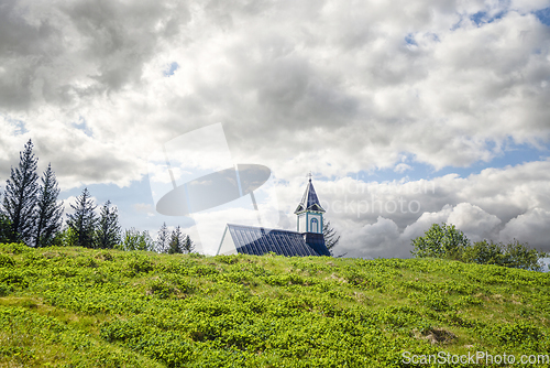 Image of Small church in a rural scenery in cloudy weather