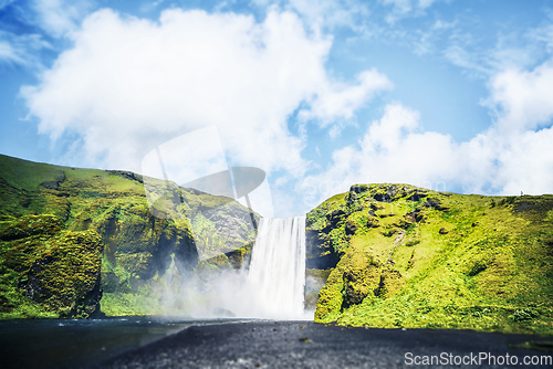 Image of Waterfall between green cliffs