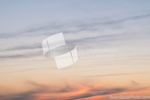 Image of Afternoon sunset with soft clouds over the sky