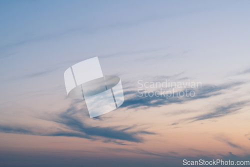 Image of Cloudy sunset with clouds in the wind