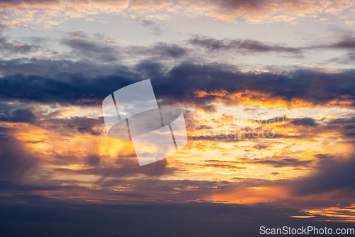 Image of Dramatic sunset in orange and violet colors