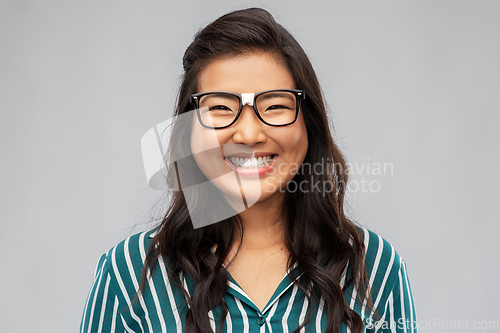 Image of portrait of happy asian woman in glasses