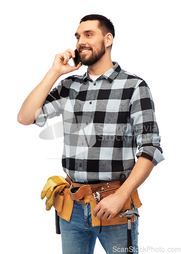 Image of builder in helmet calling on smartphone