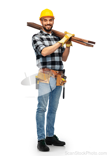 Image of happy male worker or builder in helmet with boards