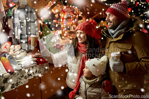 Image of family with takeaway drinks at christmas market