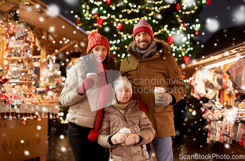 Image of family with takeaway drinks at christmas market