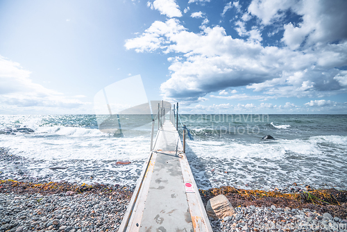 Image of Small bridge to the cold sea