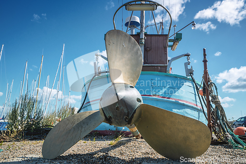 Image of Fishing boat with a large propeller on land
