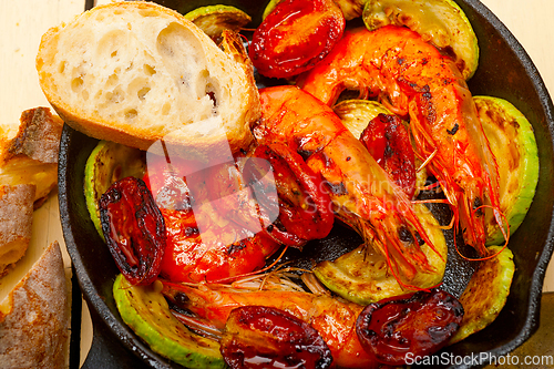 Image of roasted shrimps with zucchini and tomatoes