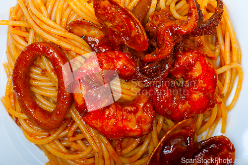 Image of Italian seafood spaghetti pasta on red tomato sauce