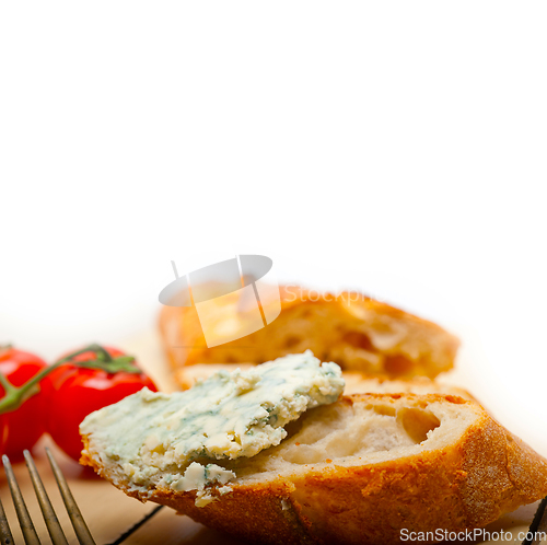 Image of fresh blue cheese spread ove french baguette