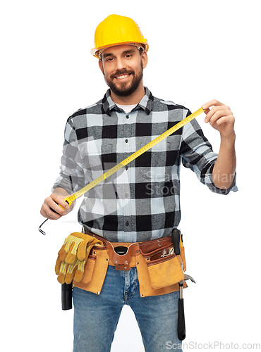 Image of happy male worker or builder in helmet with ruler