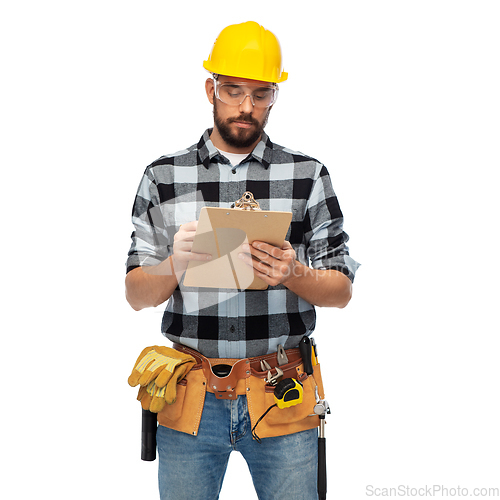 Image of male worker or builder in helmet with clipboard