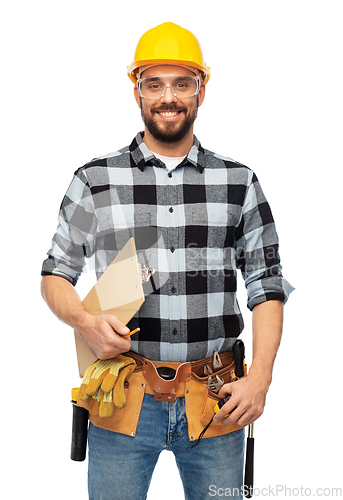 Image of male worker or builder in helmet with clipboard