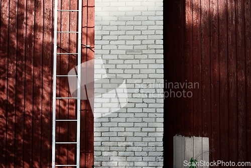 Image of wood and white brick wall and ladder