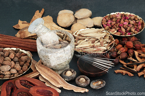 Image of Chinese Acupuncture Treatment with Needles Herbs and Spice