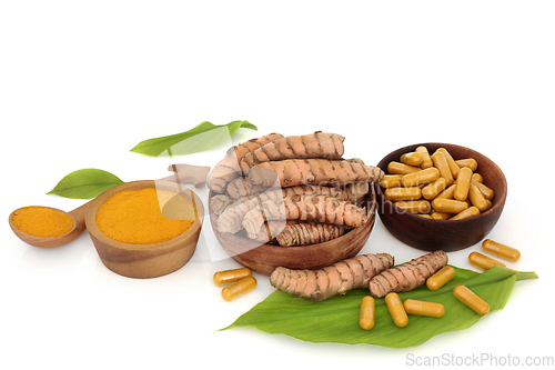 Image of Healthy Turmeric Root Powder and Supplement Capsules 