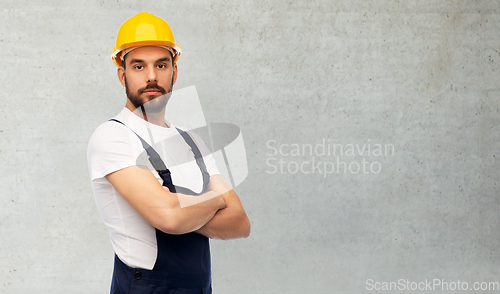 Image of male worker or builder with crossed arms