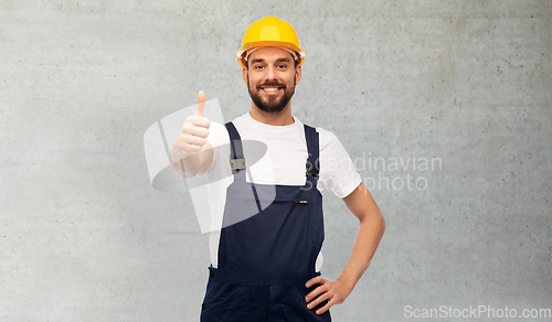 Image of male worker or builder showing thumbs up
