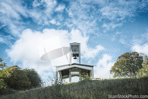 Image of Holy bell tower with religious symbols