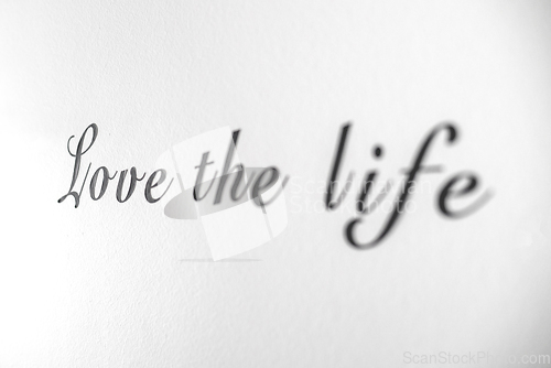 Image of Love the life word phrase on a bright white wall